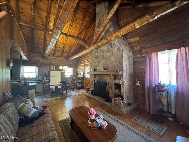 living area featuring wooden ceiling, wood-type flooring, and beam ceiling