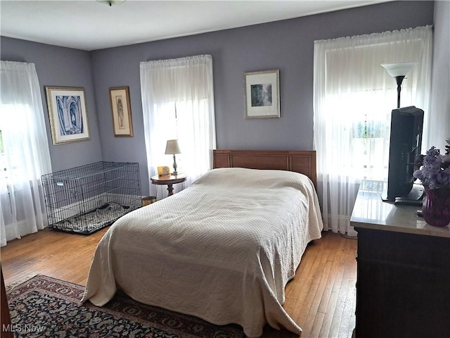 bedroom with light wood-type flooring