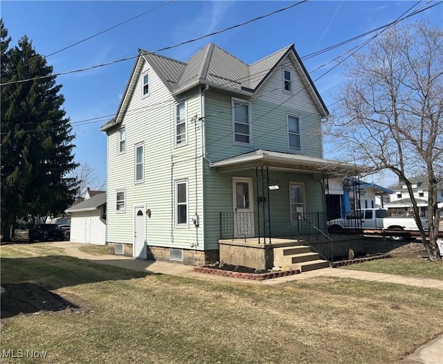 view of front of home featuring covered porch and a front lawn