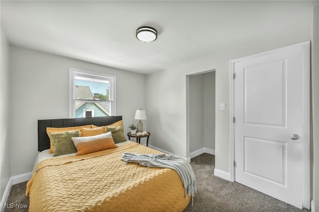 bedroom featuring baseboards and carpet floors