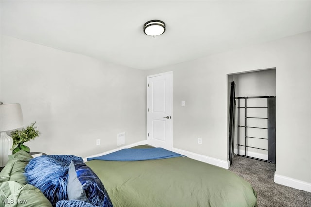 carpeted bedroom featuring baseboards