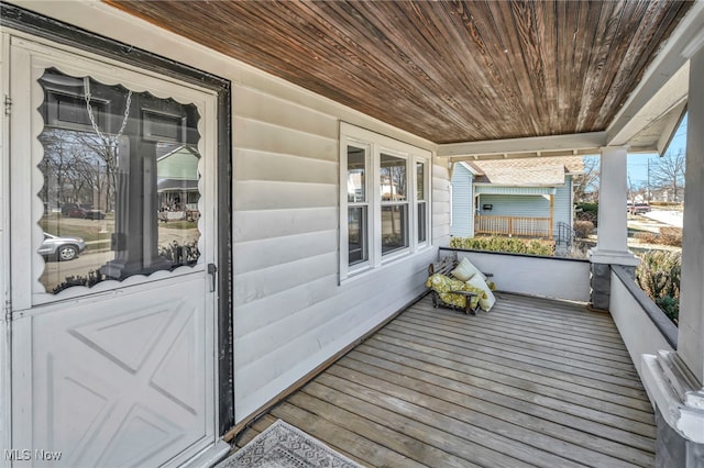 wooden deck featuring a porch