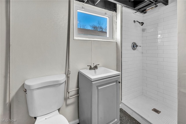 full bath featuring vanity, a shower stall, and toilet