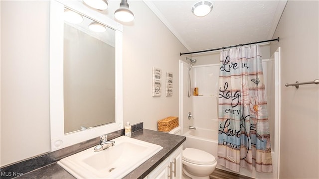 bathroom featuring shower / bath combo with shower curtain, toilet, ornamental molding, and vanity