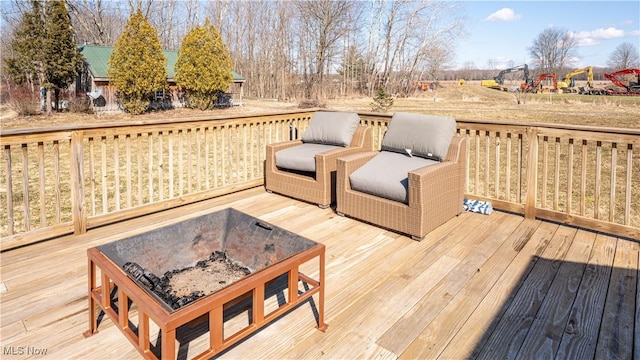 5719 N Richmond Rd, Pierpont, OH 44082 - wooden terrace with a fire pit