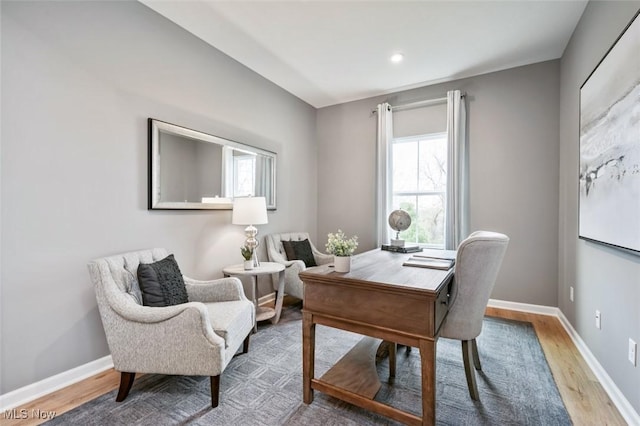 office space featuring recessed lighting, baseboards, and light wood-style floors