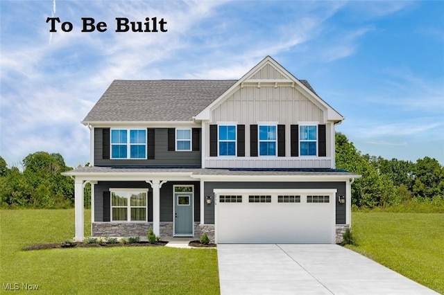 craftsman inspired home featuring an attached garage, board and batten siding, concrete driveway, and a front lawn