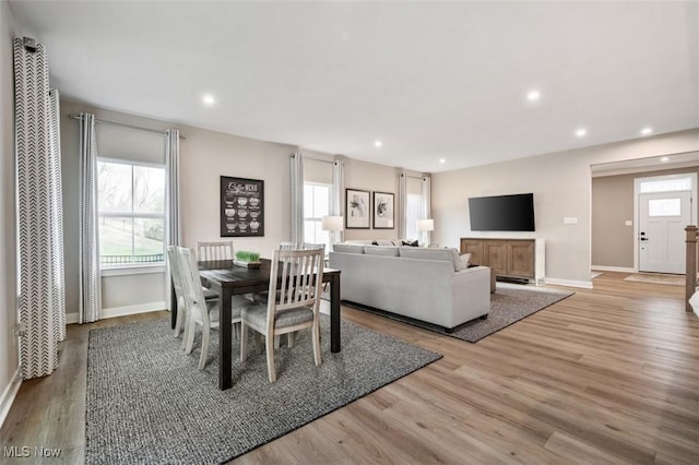 dining room featuring recessed lighting, light wood-style flooring, and baseboards