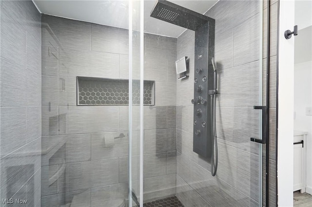 full bathroom featuring a shower stall