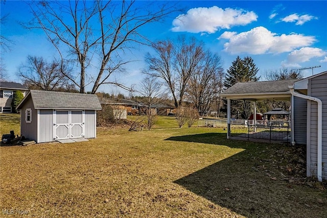 view of yard with a storage shed and an outdoor structure