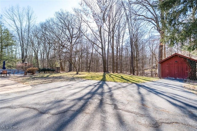 view of yard with a barn and an outdoor structure