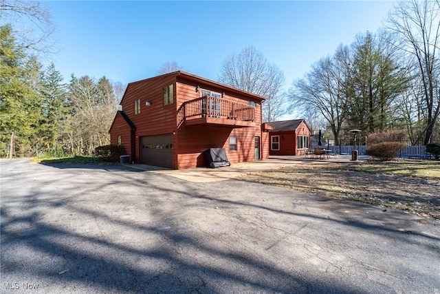 exterior space featuring an attached garage and driveway