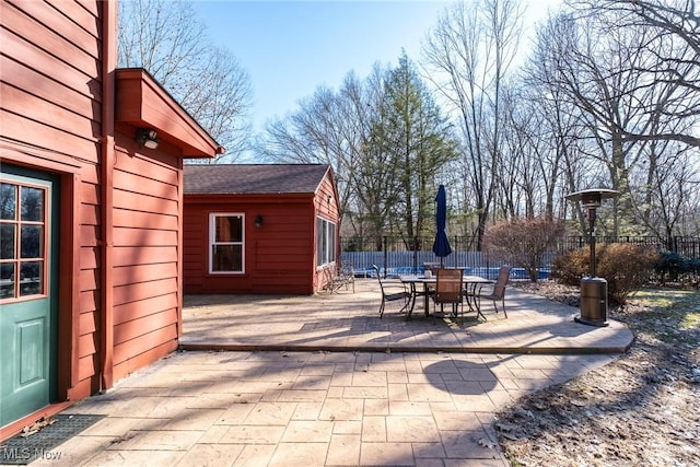 view of patio / terrace featuring outdoor dining area and fence