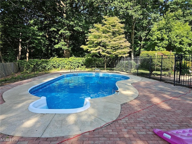 view of pool featuring a fenced in pool and fence