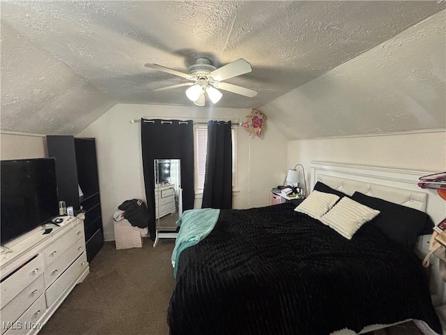 bedroom with ceiling fan, a textured ceiling, lofted ceiling, and dark colored carpet