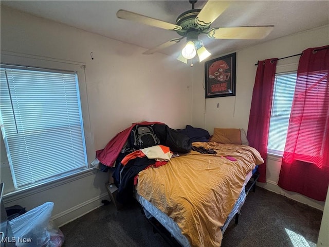 bedroom with baseboards and ceiling fan