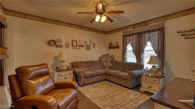 living room featuring wood finished floors and ceiling fan