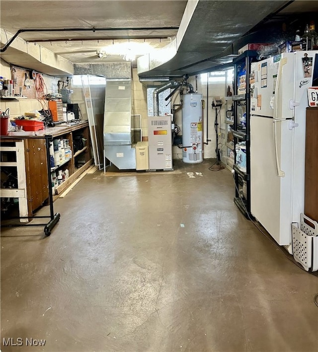 unfinished below grade area featuring heating unit, gas water heater, and freestanding refrigerator