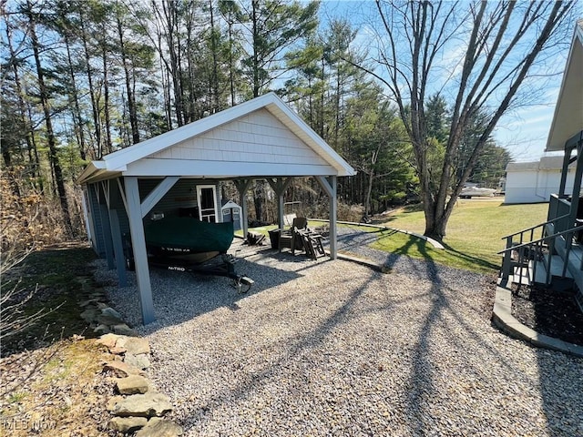 view of yard with a carport and driveway