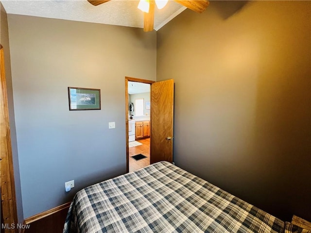 bedroom featuring baseboards, visible vents, lofted ceiling, ceiling fan, and a textured ceiling