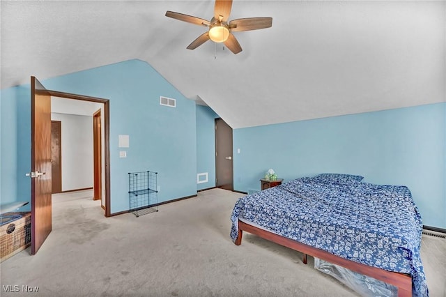 bedroom with visible vents, lofted ceiling, carpet floors, and ceiling fan