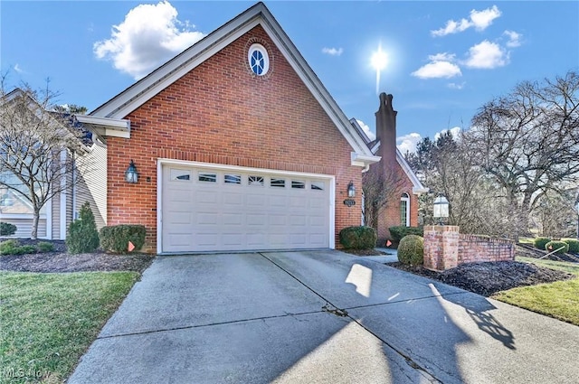 view of side of property featuring brick siding, concrete driveway, and a chimney