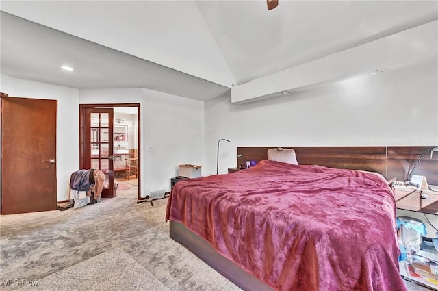 carpeted bedroom featuring baseboards, lofted ceiling, and ceiling fan