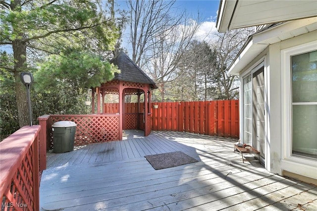 deck with a gazebo and fence