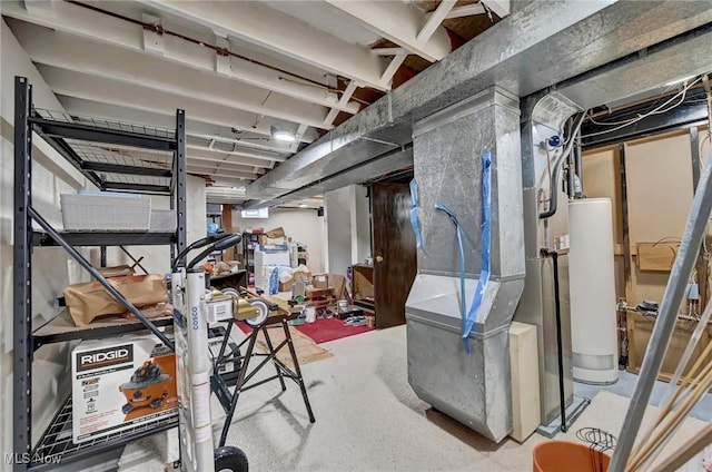 basement featuring water heater and heating unit