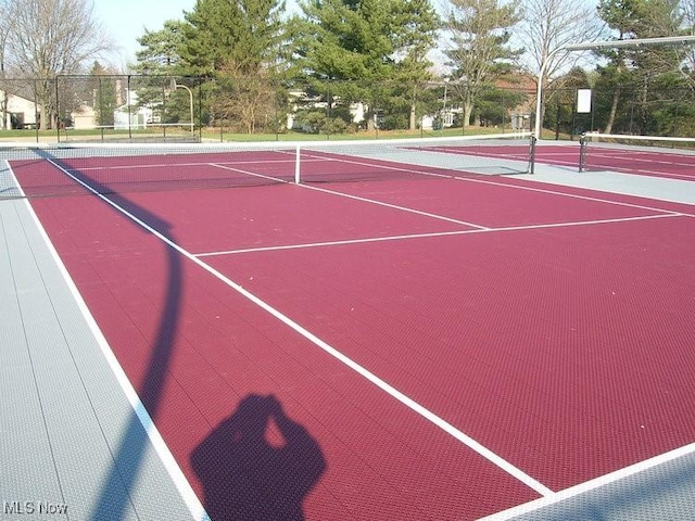 view of sport court with community basketball court and fence