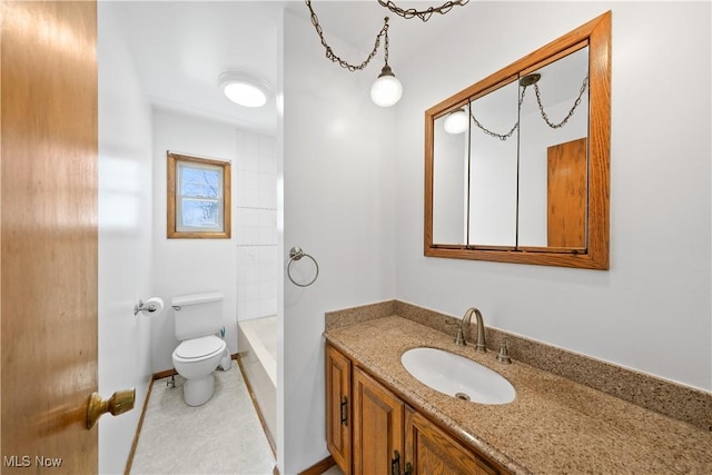 bathroom with toilet and vanity