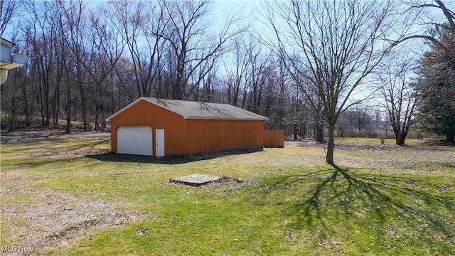 view of yard with an outbuilding and a detached garage