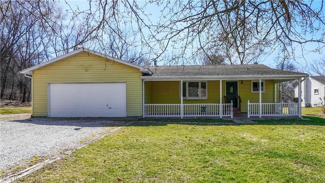 ranch-style home featuring gravel driveway, a front yard, a porch, and an attached garage