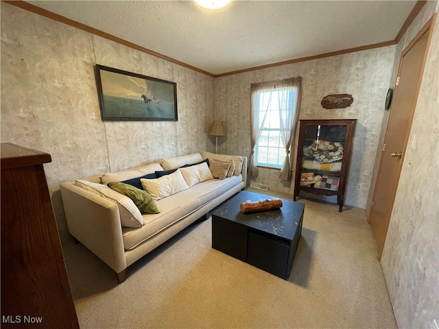 carpeted living area featuring a textured ceiling, wallpapered walls, and ornamental molding