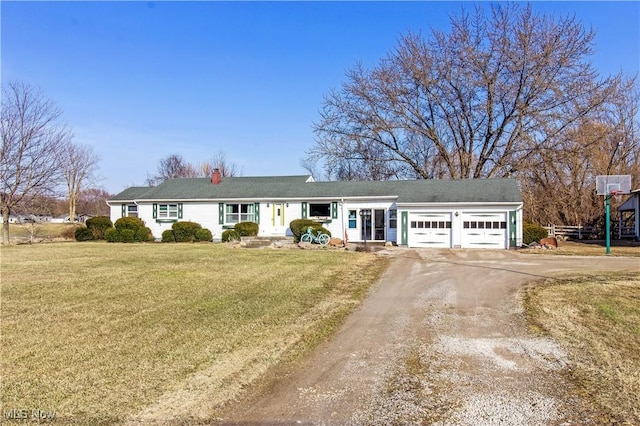 ranch-style home featuring a front yard, an attached garage, and dirt driveway