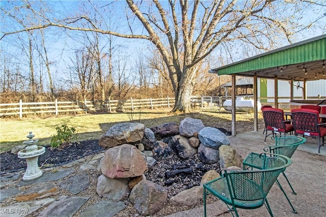 view of patio / terrace featuring fence