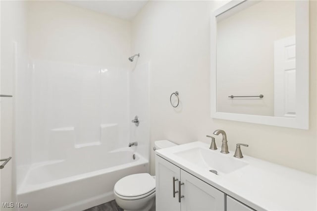 full bathroom featuring toilet, vanity, and bathing tub / shower combination