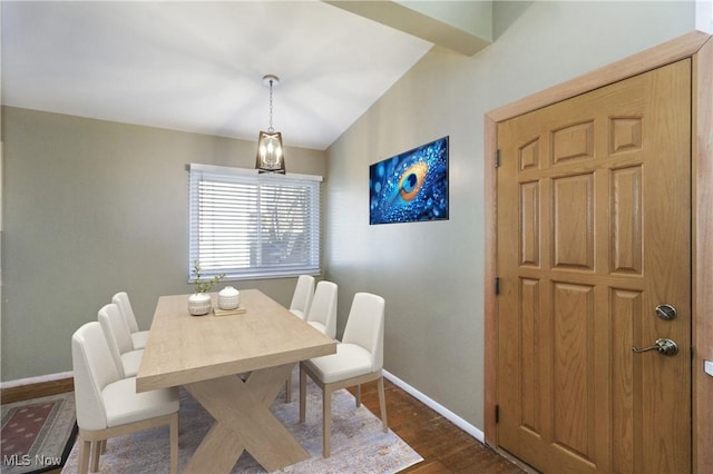 dining room with dark wood-style floors and baseboards