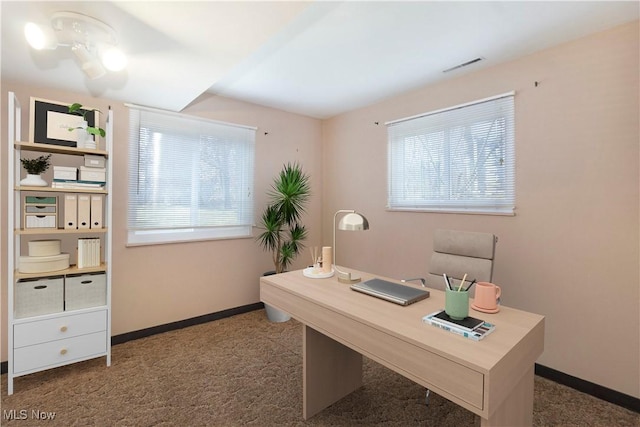 office area featuring visible vents, carpet, and baseboards