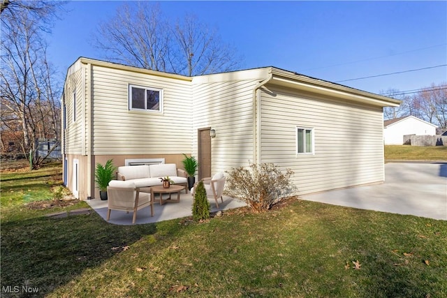 rear view of house featuring a patio area, outdoor lounge area, and a yard