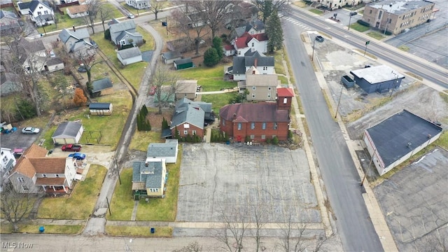 birds eye view of property with a residential view