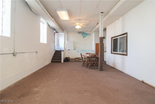 unfurnished dining area featuring stairway