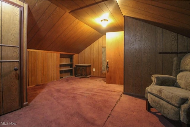 additional living space featuring wood walls, wood ceiling, lofted ceiling, and carpet floors