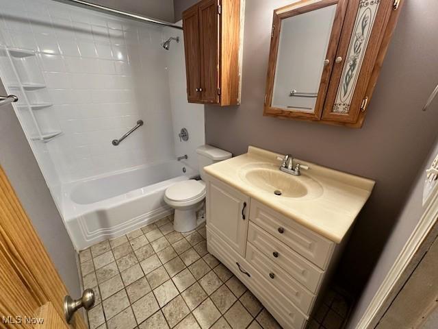 bathroom with vanity, toilet, and tub / shower combination