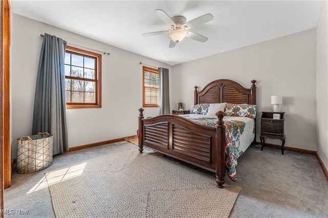 carpeted bedroom with baseboards and ceiling fan