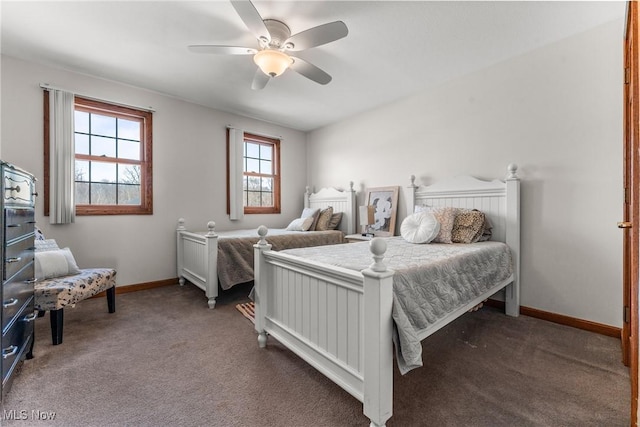 carpeted bedroom with baseboards and ceiling fan