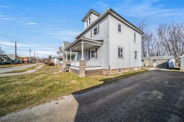 view of property exterior with a porch and a yard