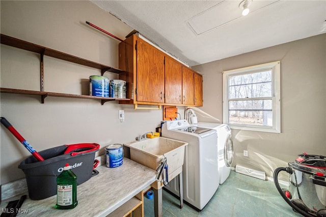 laundry area featuring cabinet space and washing machine and dryer