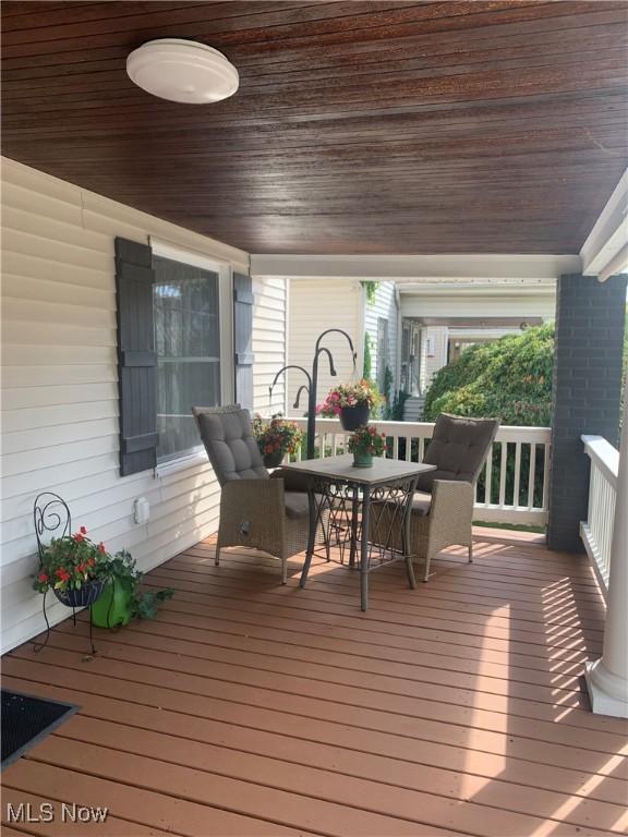 deck featuring outdoor dining area