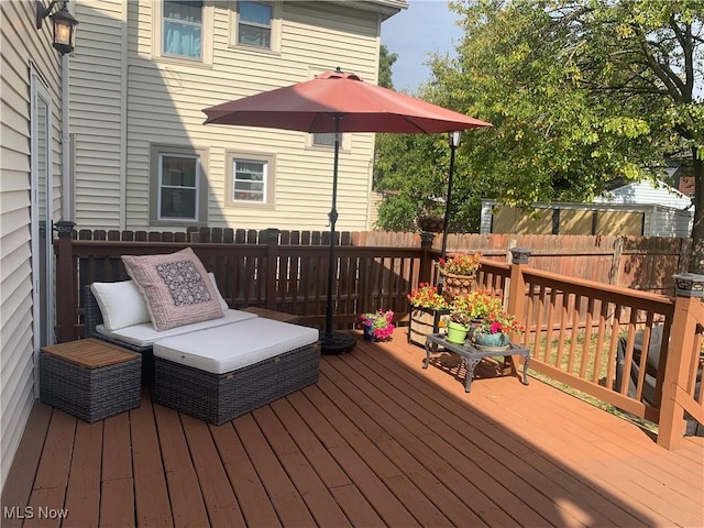 wooden deck featuring fence